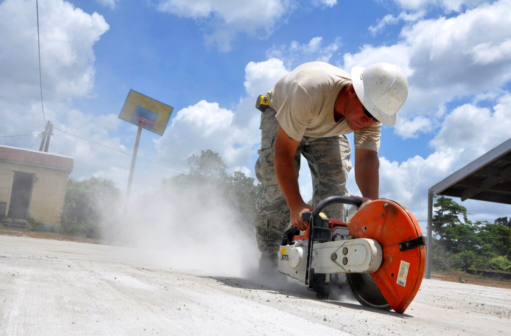Cutting concrete with a gas cutoff saw in action